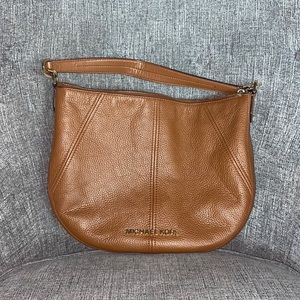 Michael Kors shoulder bag. Cognac color, tan inside, gold zipper. 11in x 10in
